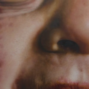 Hyperrealistic oil painting of a child's smile and facial details by Jan Petrov, from the Family Re-Construct series.