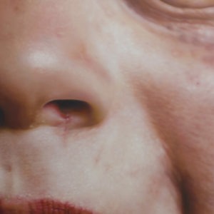 Hyperrealistic oil painting of a child's smile and facial details by Jan Petrov, from the Family Re-Construct series.